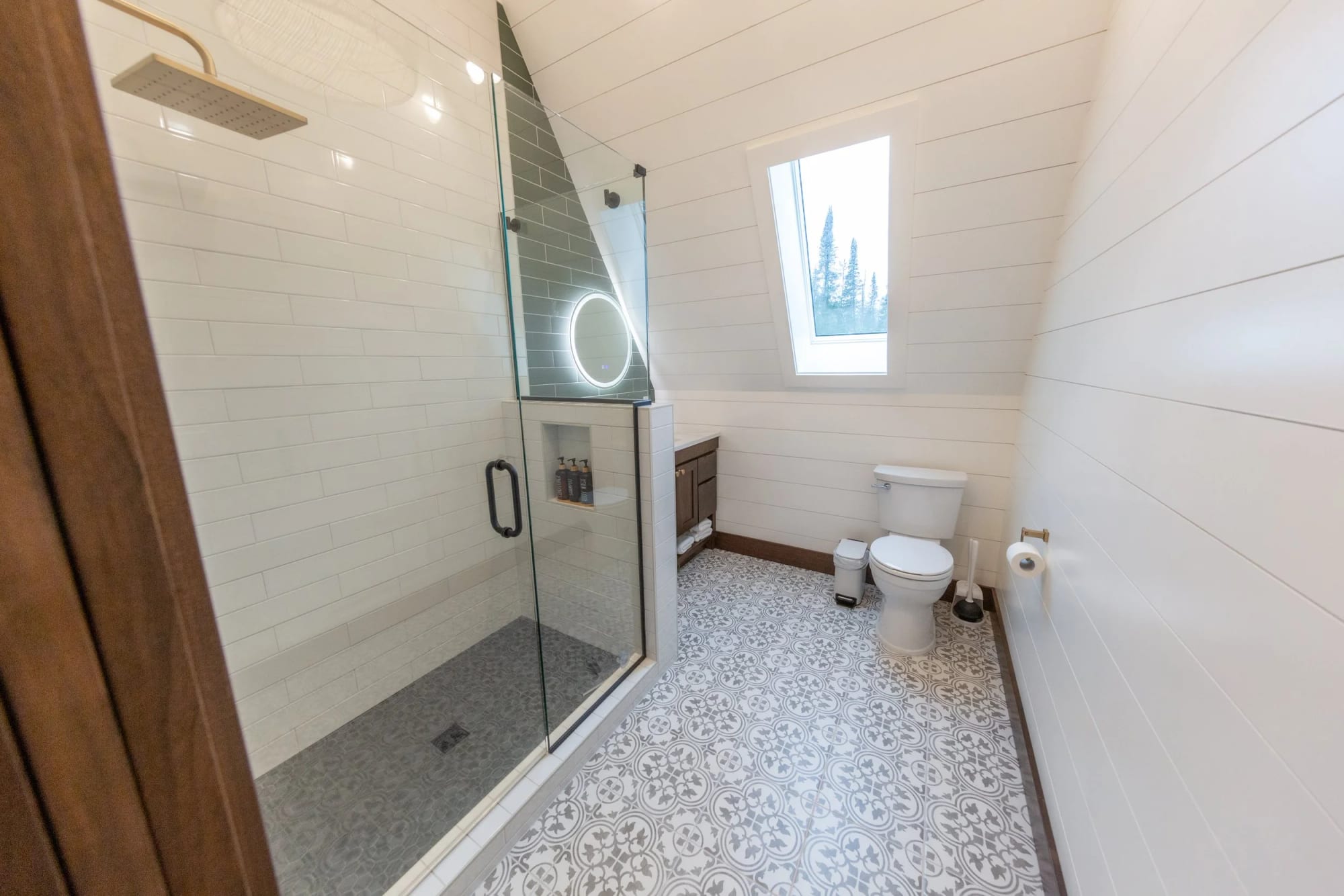A walk-in shower under the roof pitch