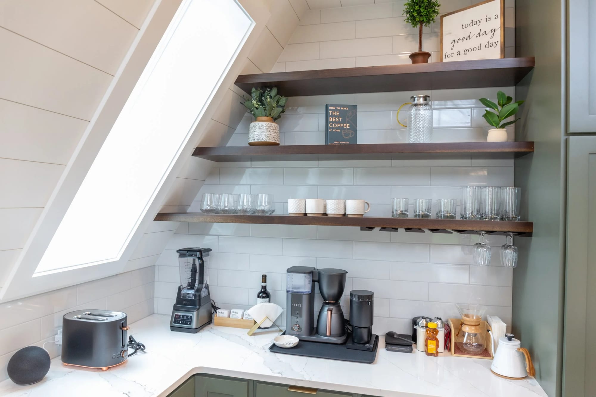 The stocked coffee bar on open shelving