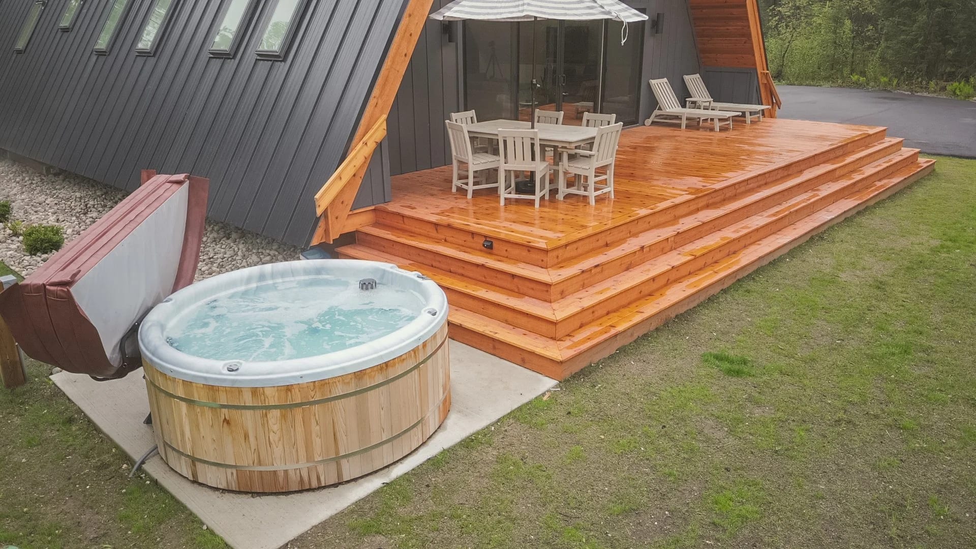 The hot tub and deck seen from the lawn