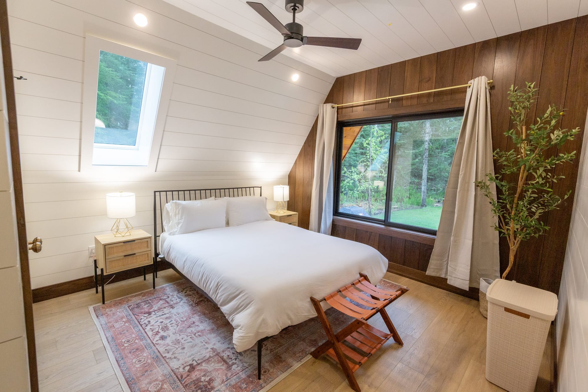 A bedroom suite with a walnut accent wall