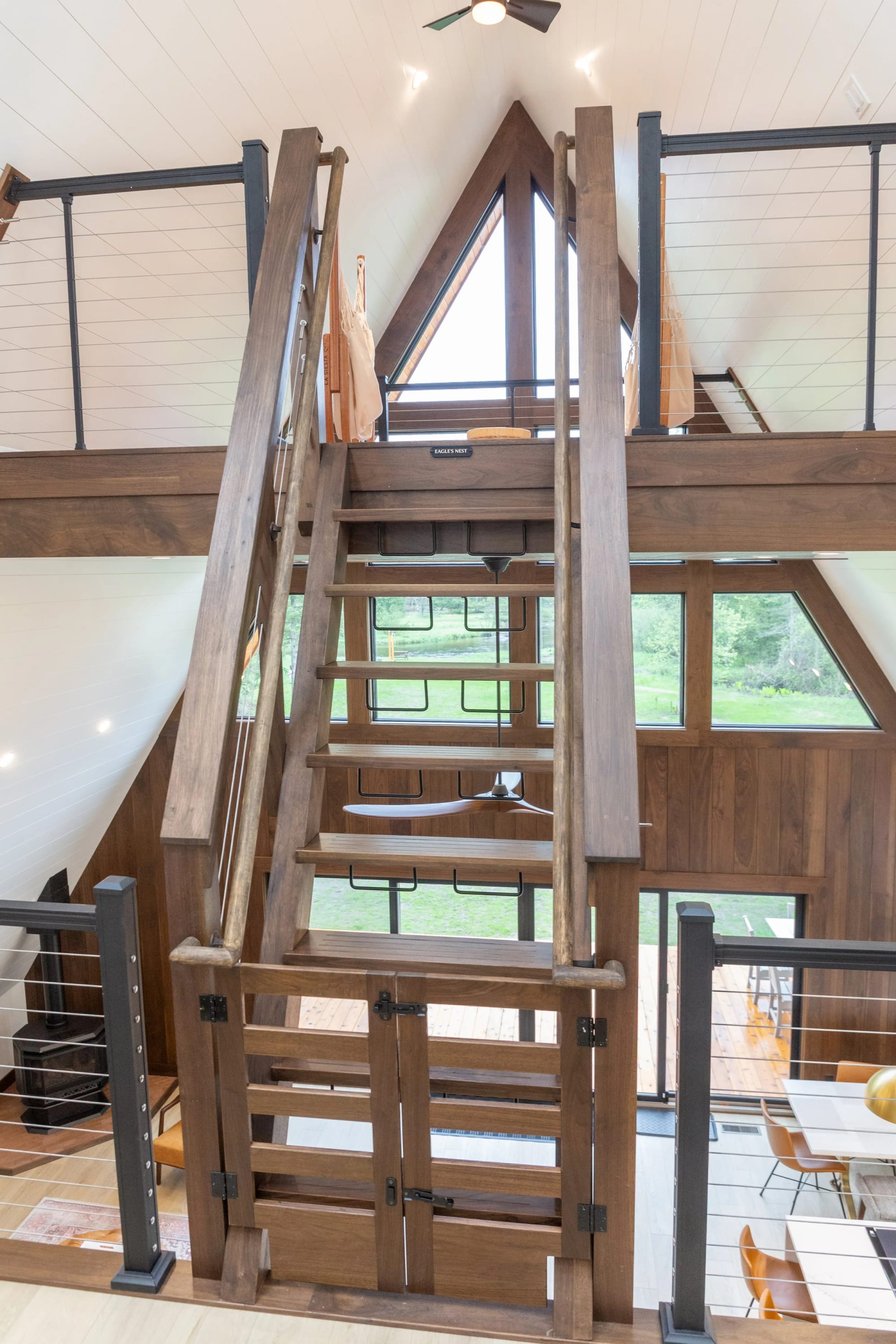 The timber stair rising to the mezzanine