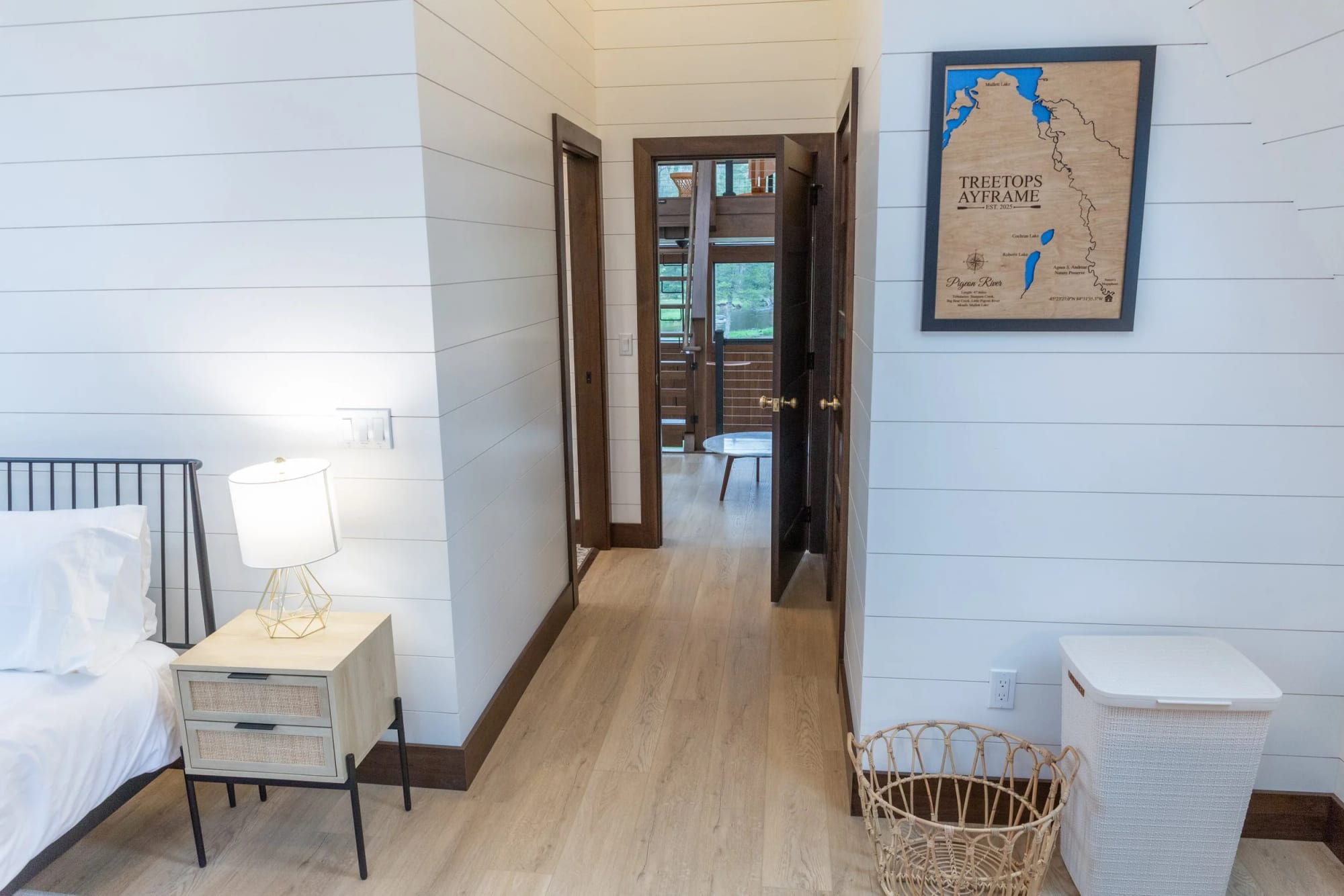 A bedroom with its en-suite door open